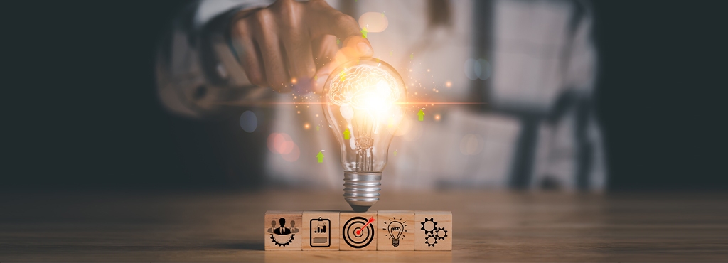 Business innovation concept with glowing light bulb, strategy icons, and creative ideas