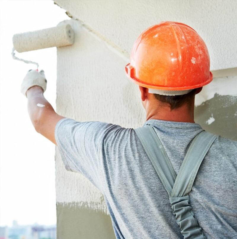 Man working aws an Exterior Painting